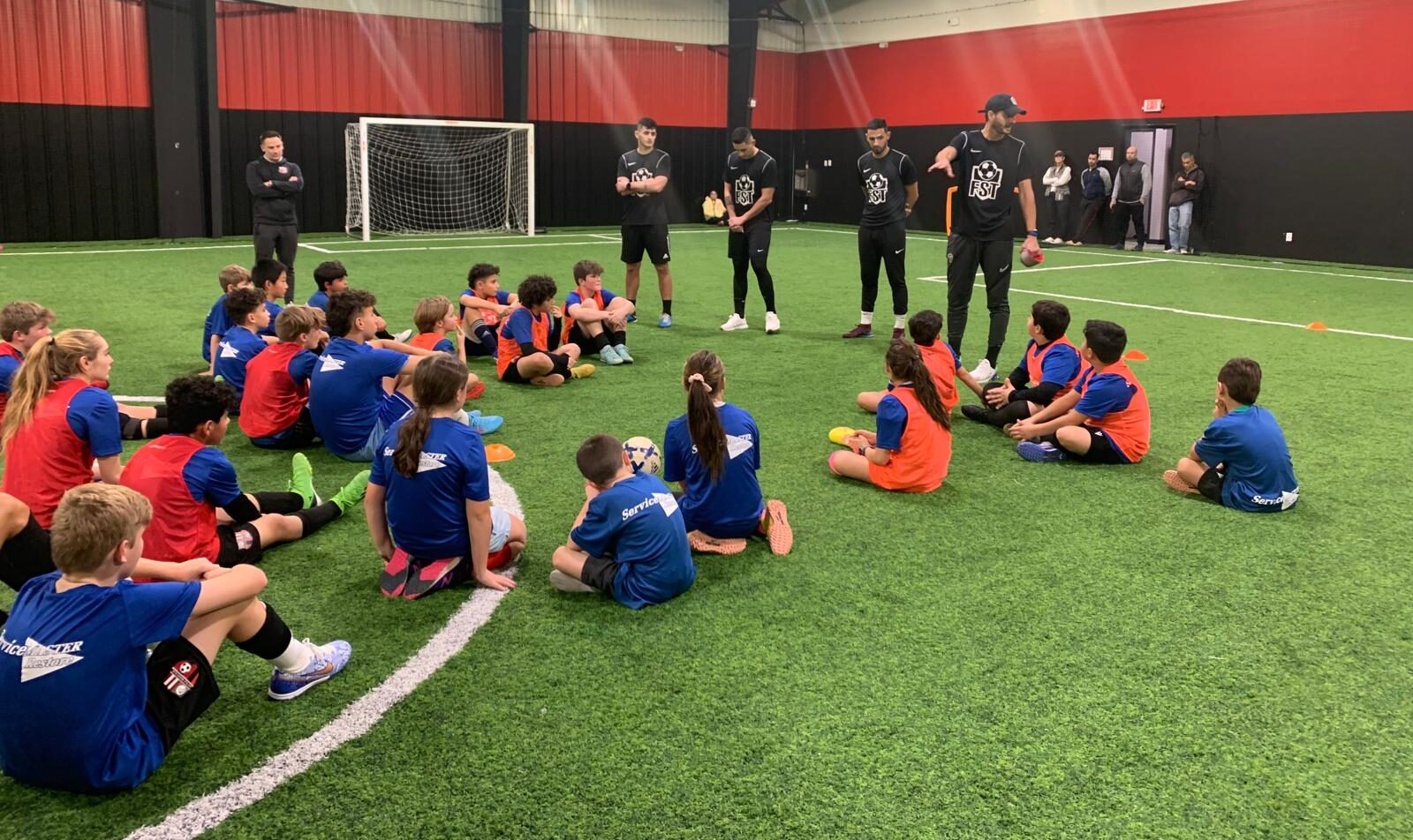 ndoor youth soccer clinic with JP Soccer and FST coaches training players ages 4–14.